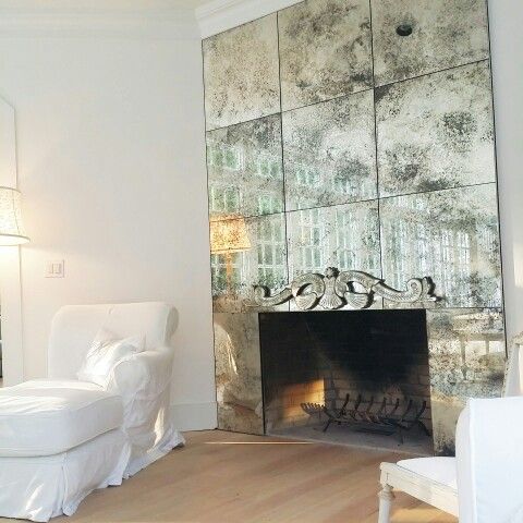 highlight the fireplace with a faded mirror cover to make it stand out in a refined way