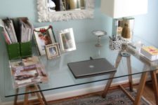27 a combo of stained wooden trestle legs and a glass tabletop can be a nice refreshing idea for a rustic home office