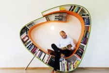 27 a dynamic bookshelf with a seat inside and an additional light bulb for every book lover