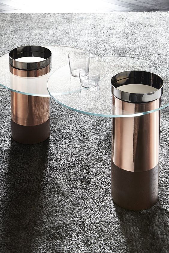 chic round modern coffee tables with copper bases with glass tabletops will spruce up your space