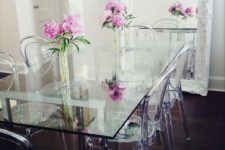 29 a vintage dining room is made more eye-catching with an ultra-modern glass top dining table and acrylic chairs
