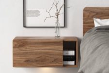 30 a wooden floating nightstand with a sliding door for comfy storage