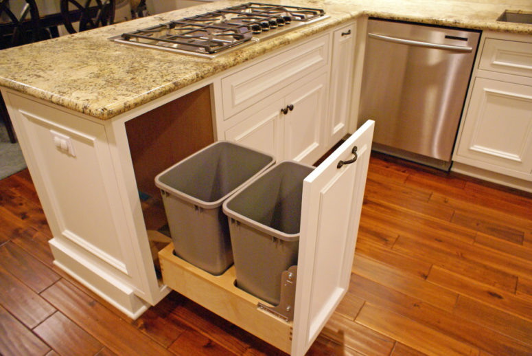 a soft-close trash can pull-out with a possibility to separate food compost from trash (Danzo Group Custom Cabinets &amp; Woodworking)