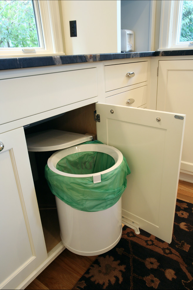 a super smart trash can pull-out with a lid that opens automatically (Rockwood Cabinetry)