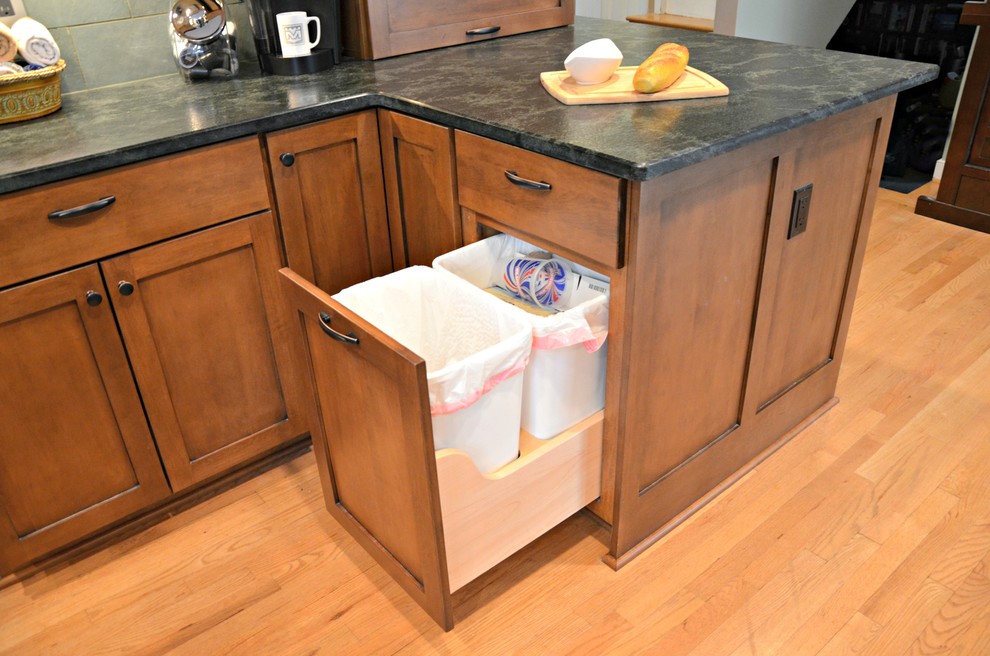 a craftsman kitchen can feature smart hidden trash can storage too
