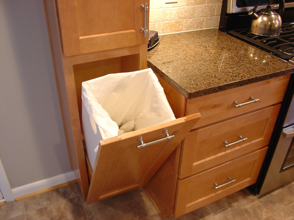 a cool custom tilt out trash can (Lazzell Design Works Remodeling)
