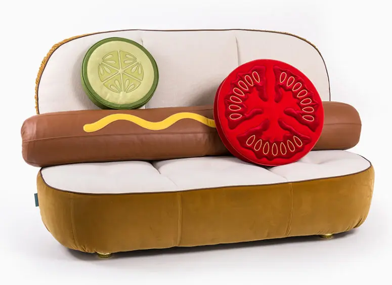 UN_LIMITED EDITIONS is a furniture collection inspired by fast food, the open hot dog bun is a sofa, a tomato and cucumber slice are pillows