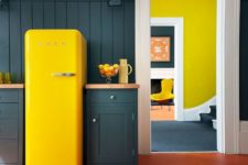 03 a graphite grey kitchen with a sunny yellow Smeg fridge for a bold statement