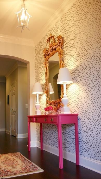 glam dalmatian print statement wall for a bold hallway and a hit pink console to nail it