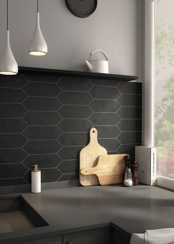matte black tile kitchen backsplash and concrete countertops for a chic masculine kitchen