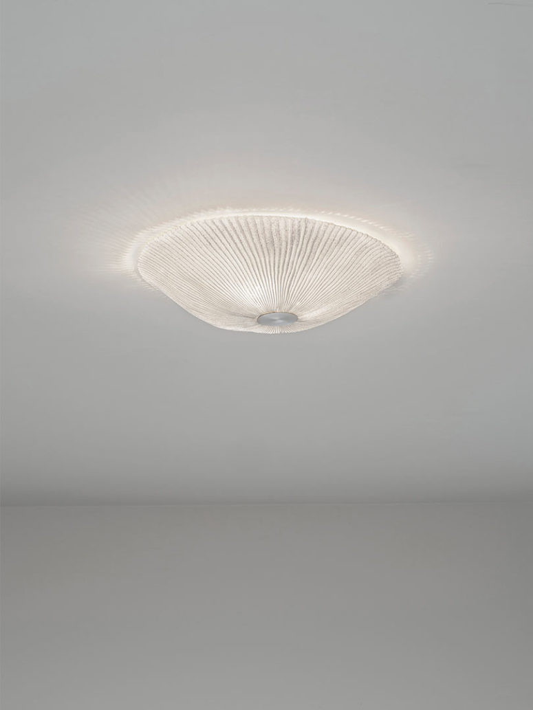 This is a ceiling lamp looking like a glowing shell or jelly fish