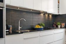 04 matte black rectangular tiles add texture to the kitchen decor