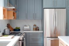 04 pale blue vintage kitchen with metallic handles and white countertops