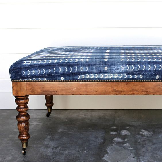 renovate an old bench adding casters and reupholstering it with shibori fabric to give it a cool look