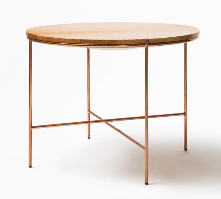 A round table will fit any modern space, and chic copper touches are right what you need
