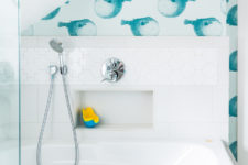 05 The bathtub is surrounded with white puzzle-shape tiles and there’s a built-in shelf