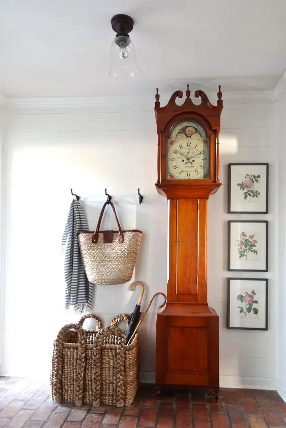 a large grandfather's clock is a show-stopper in a rustic entryway
