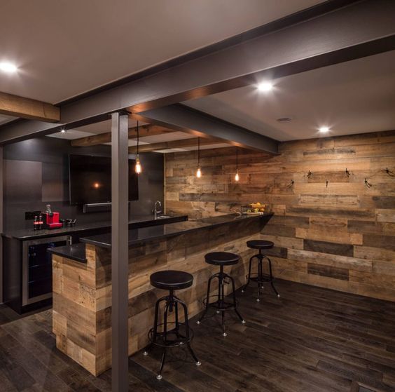 a rustic and modern space with lots of wood and metal surfaces, bulbs for lights