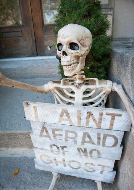 a skeleton with a proper fun sign will be a nice decoration for your porch