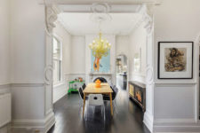 06 Here’s a dining room with modern dinign furniture, an antique sideboard and a modern and bold chandelier