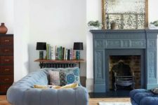 06 a slate grey painted fireplace features a metal construction that allows using it