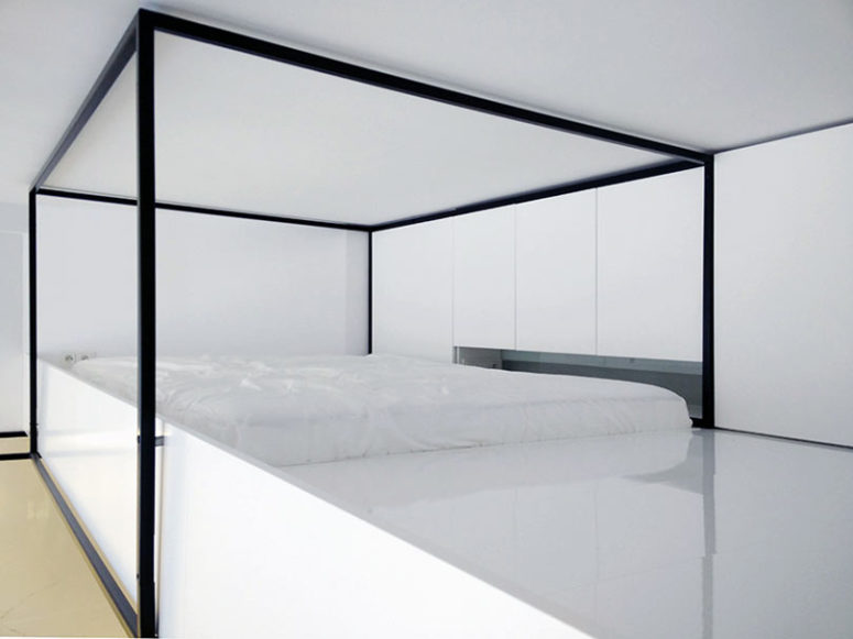 The bedroom features a platform, which acts as a bed and some cabinets - who needs more for comfortable sleep