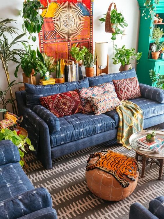 Shibori upholstered sofa and armchairs look outstand in this warm colored boho chic room