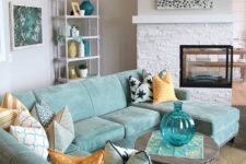 08 a neutral room is spruced up with a gorgeous aqua sectional sofa and accessories