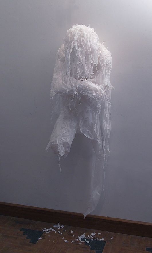 a wall ghost of shredded trash bags is a creative and very scary idea
