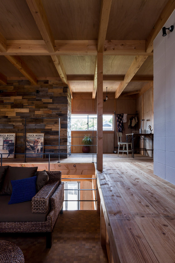You can see a small workspace in the corner of the house and wood beams on the ceilings