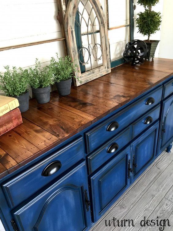cobalt blue ktichen cabinets with pallet wood countertops for a bold contrast