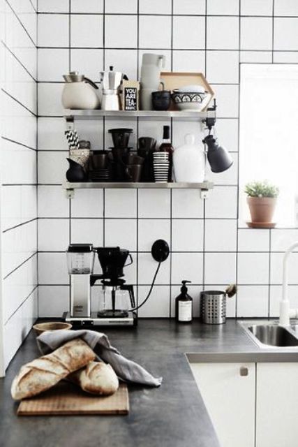 Matte white square tiles with black grout for a mid century modern Scandinavian kitchen