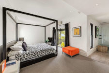 11 The master bedroom features a framed bed, bold pieces and a balcony to enjoy fresh air