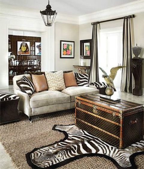 African flavor room with a large dark vintage chest as a coffee table   feel the adventure spirit