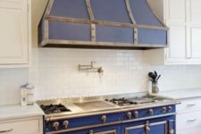 12 a beautiful retro blue kitchen stove with a hood and stainless steel fittings