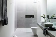 12 large scale matte grey tiles for a peaceful minimalist bathroom