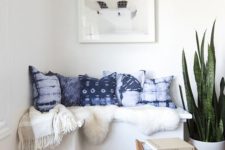 13 a cozy reading nook is spruced up with shibori pillows and a faux fur cover