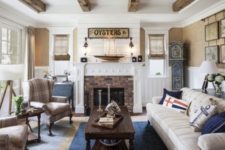 13 a rustic space with a brick clad fireplace, plaid chairs and a vintage blue clock