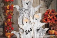 13 wood cut ghosts with webs, letters and lit up eyes for outdoor or indoor decor