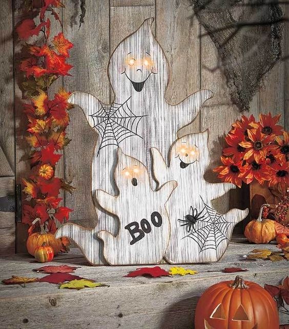 wood cut ghosts with webs, letters and lit up eyes for outdoor or indoor decor