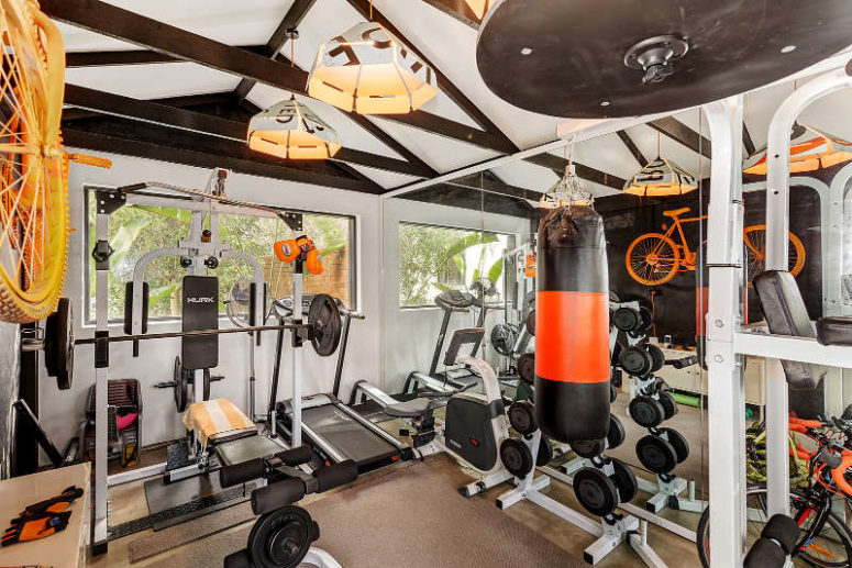 There's a private gym made with yellow and orange touches