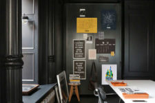 14 There’s also a home office done in black with colorful details that enliven the space