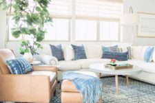 15 a large white sectional sofa is made trendier with shibori pillows