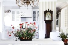 15 a modern space is made more eye-catchy with a vintage-inspired chandelier and a vintage clock