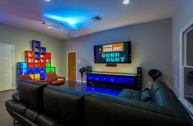 a modern video game room will accomodate all your friends and will look very inviting