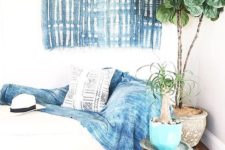 17 a shibori blanket and a wall hanging to make the room more eye-catching