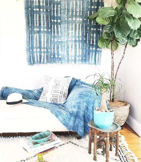 a shibori blanket and a wall hanging to make the room more eye-catching