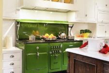 17 a traditional white kitchen with a green retro stove and a natural wood kitchen island