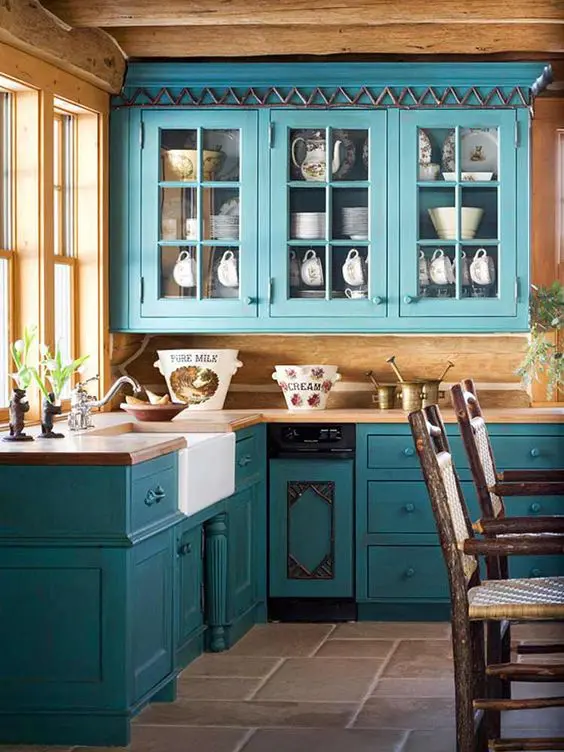 turquoise blue cabinets in vintage style and lots of natural wood for a rustic feel