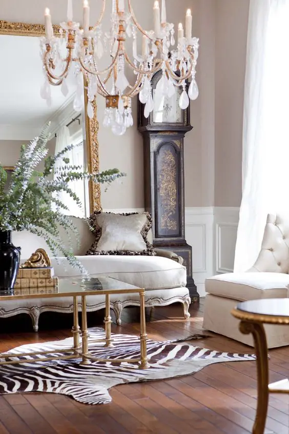 A luxurious interior with a grandfather's clock, a refined sofa and an animal print inspired rug